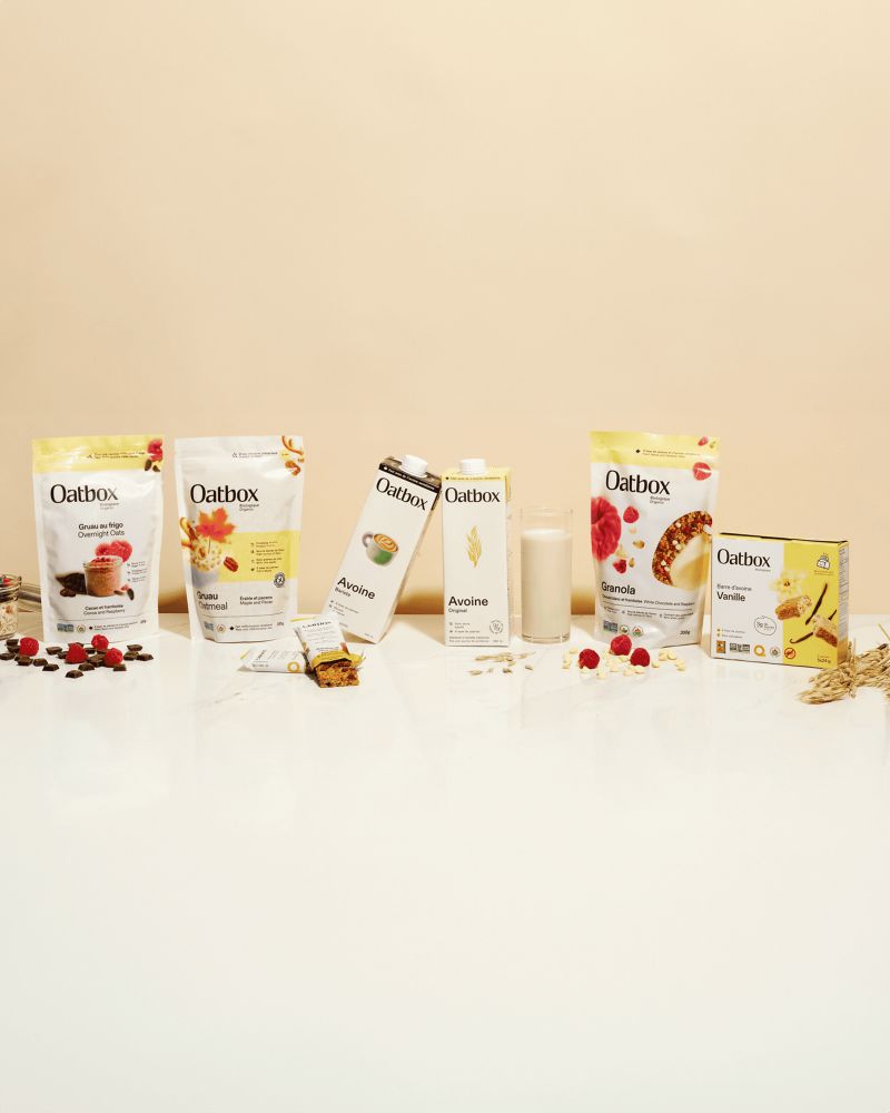 A range of Oatbox products displayed on a light table.