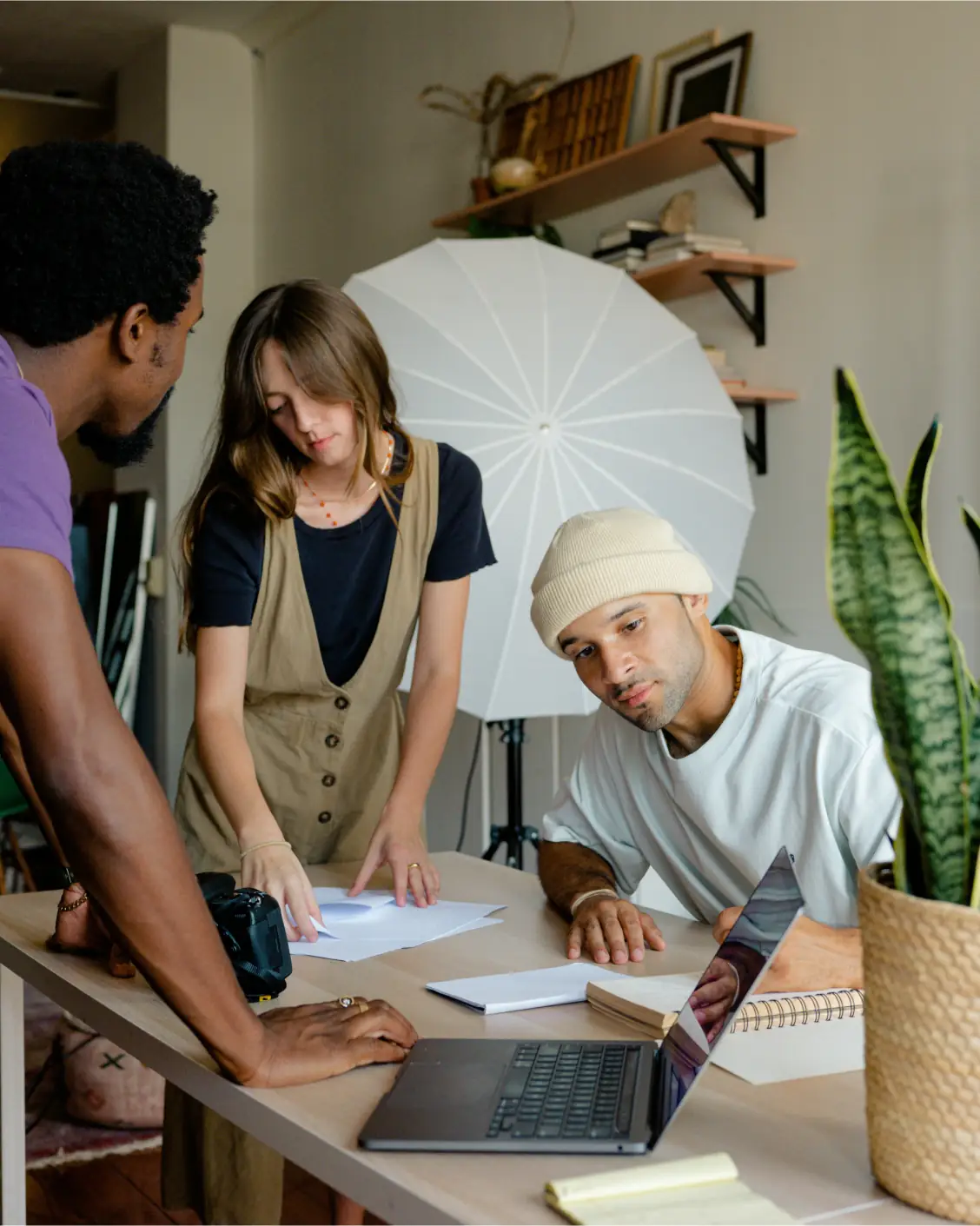 A team gathered around a table during a working session.